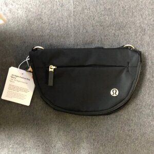 Lululemon Athletica Black and Gold Crossbody Bag Sleek Design